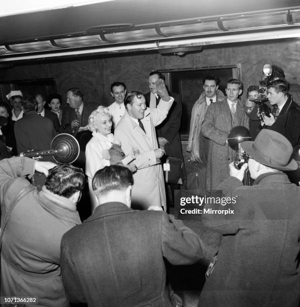 Bill Haley on his first visit to England which was largely sponsored by the Daily Mirror, Bill arrives at Waterloo with his wife Cuppy. 5th February...