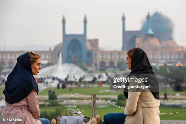 iranian women in front of shah mosque, isfahan - esfahan stock pictures, royalty-free photos & images