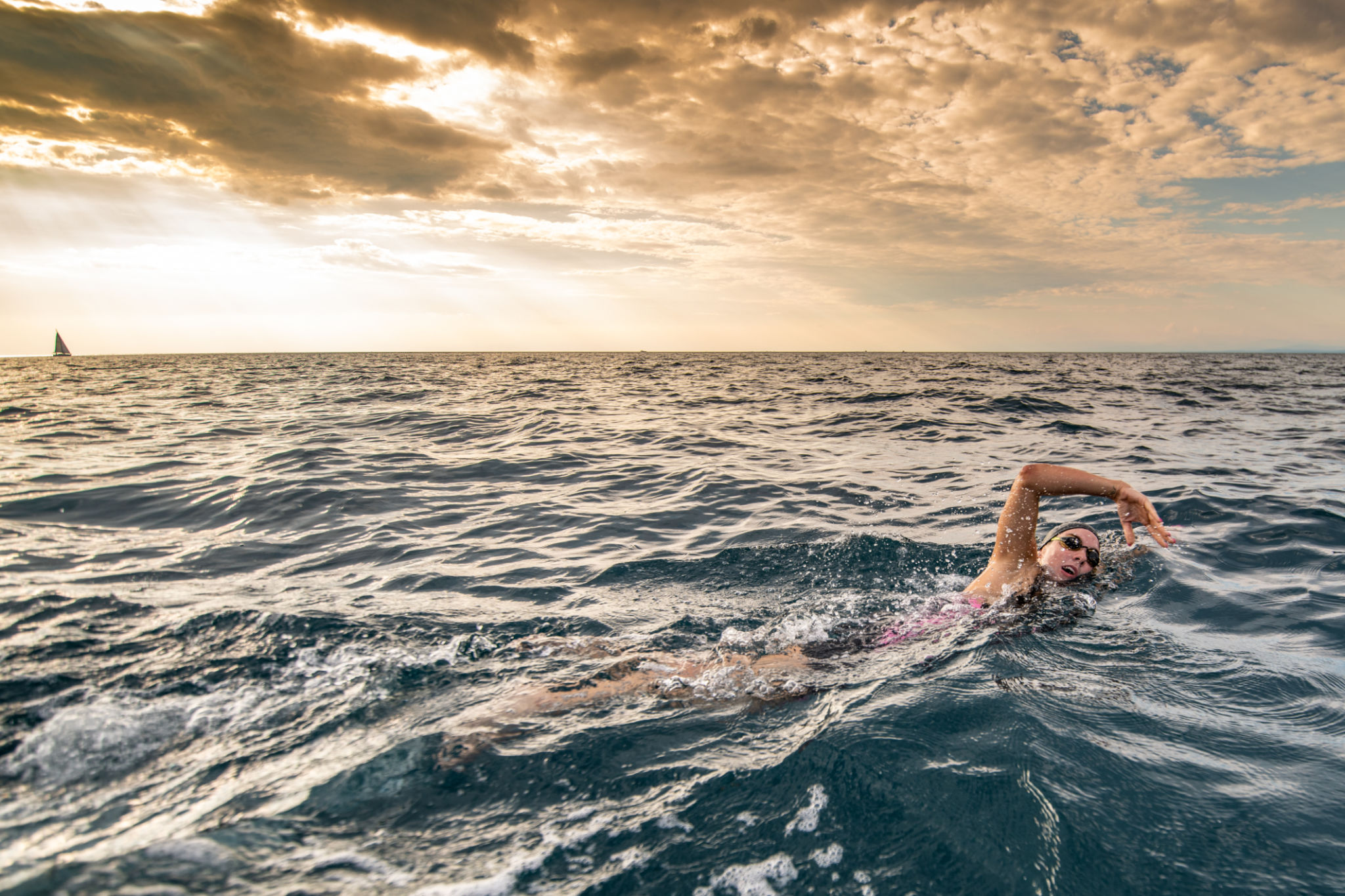 Open water swimmer swimming in sea Open water swimmer swimming in sea