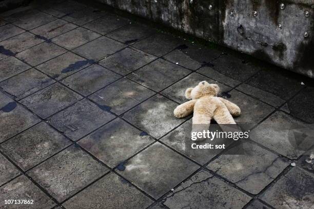 big teddy bear falling down on the roof - missing child stock pictures, royalty-free photos & images