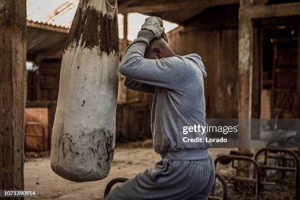 black fighter working out in an abandoned farm - shadow boxing stock pictures, royalty-free photos & images