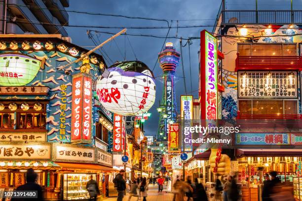 osaka shinsekai at night tsutenkaku tower - osaka shinsekai food stock pictures, royalty-free photos & images