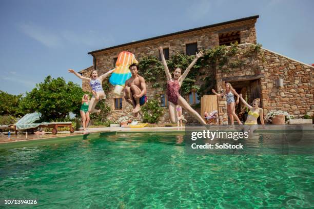 making the most of their holiday - tuscan villa stock pictures, royalty-free photos & images