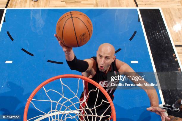 Zydrunas Ilgauskas of the Miami Heat takes the ball to the basket against the Orlando Magic on November 24, 2010 at the Amway Center in Orlando,...