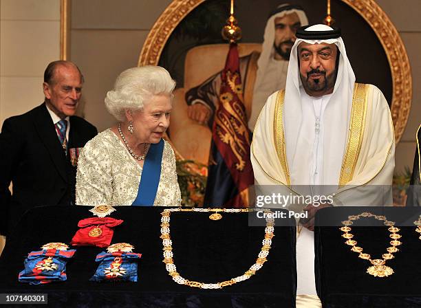 Queen Elizabeth II exchanges gifts with the President of the United Arab Emirates, Sheikh Khalifa Bin Zayed al Nahyan at the Mushrif Palace on...