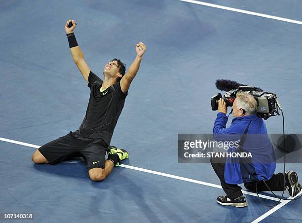 Rafael Nadal of Spain falls to the court as he celebrates his 6-4, 5-7, 6-4, 6-2 win over Novak Djokovic of Serbia in the Men's Finals at the US Open...