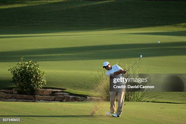 Francesco Molinari of Italy plays his third shot at the 18th hole during the first round of the Dubai World Championship on the Earth Course at...