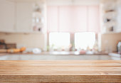 Wooden tabletop over defocused kitchen background