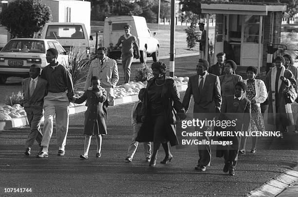 Winnie Madikizela-Mandela holding the hand of her son, the late Makgatho Mandela after visiting Nelson Mandela Victor Verster prison in Paarl with...