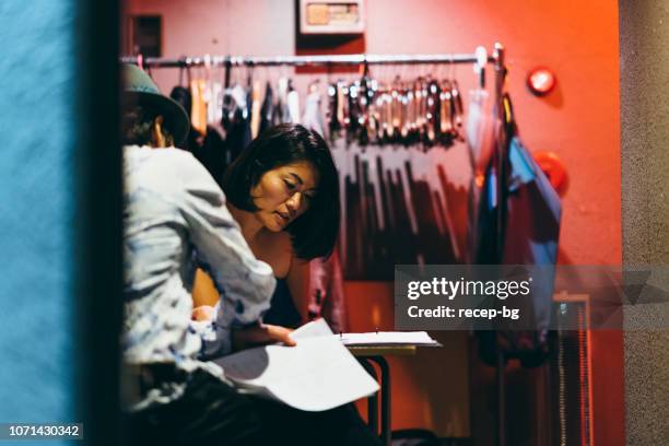 multi ethnic music group getting ready for live event at backstage - backstage stock pictures, royalty-free photos & images