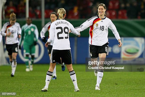 Kerstin Garrefrekes of Germany celebrates after scoring her team's second goal with team mate Lena Goessling of Germany during the women's...