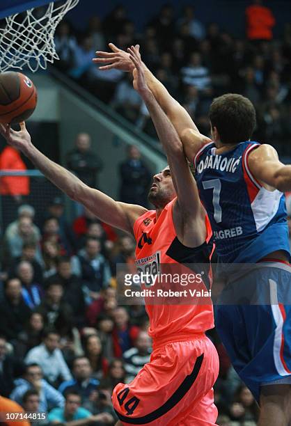 Roger Grimau, #44 of Regal FC Barcelona competes with Bojan Bogdanovic, #7 of Cibona Zagreb in action during the 2010-2011 Turkish Airlines...