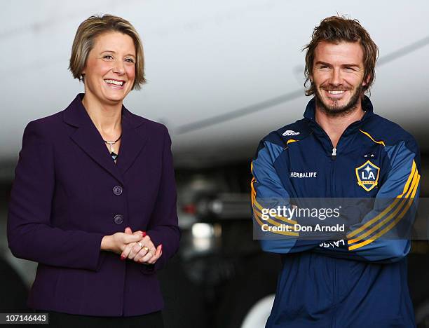 Premier Kristina Keneally stands beside David Beckham upon his arrival at Sydney International Airport on November 25, 2010 in Sydney, Australia.