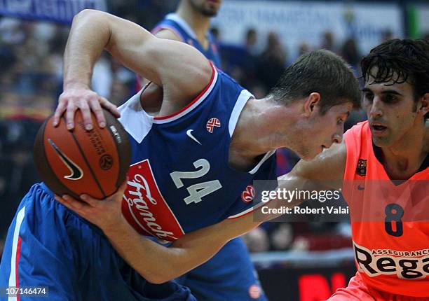 Karlo Vragovic, #24 of Cibona Zagreb competes with Victor Sada, #8 of Regal FC Barcelona during the 2010-2011 Turkish Airlines Euroleague Regular...