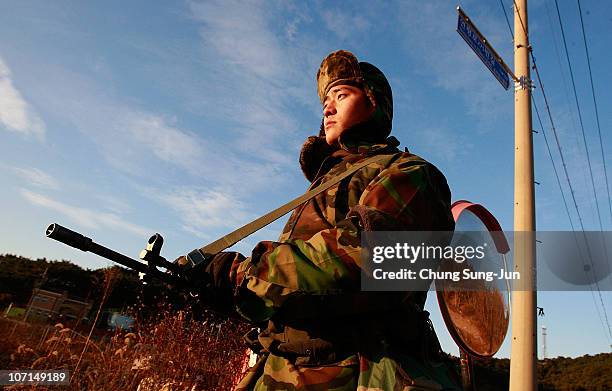 South Korean marines patrol on Yeonpyeong Island on November 26, 2010 in Yeonpyeong Island, South Korea. South Korean Prime Minister Lee Myung-bak...