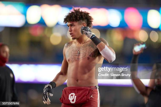 Oklahoma Robert Barnes before game vs West Virginia at Mountaineer Field at Milan Puskar Stadium. Barnes topless without jersey showing chest...