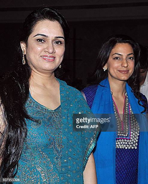 Indian Bollywood actress Padmini Kolhapure and Juhi Chawla arrive for the Divine Felicitations ceremony in Mumbai on November 25. 2010. AFP PHOTO/STR