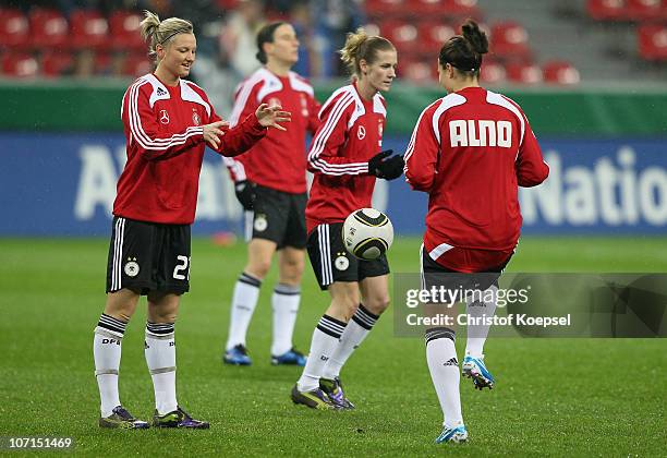 Alexandra Popp of Germany and Josephine Henning of Gerrmany warm up before the women's international friendly match between Germany and Nigeria at...