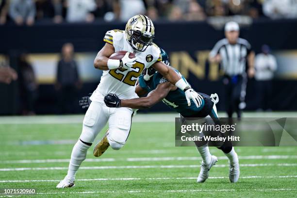 Mark Ingram II of the New Orleans Saints runs the ball and is tackled by Corey Graham of the Philadelphia Eagles at Mercedes-Benz Superdome on...