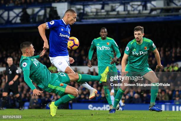 Richarlison of Everton is tackled by Craig Cathcart of Watford at close range during the Premier League match between Everton and Watford at Goodison...