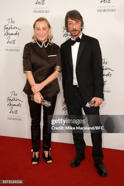 Miuccia Prada winner of Outstanding Achievement award and Pier Paolo Piccioli for Valentino winner of Designer of the Year in the winners room during...