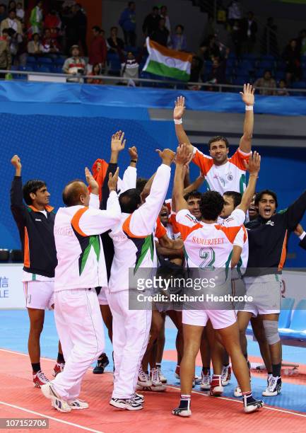 India celebrate victory over Iran during the Men's Kabaddi final at Nansha Gymnasium during day fourteen of the 16th Asian Games Guangzhou 2010 on...