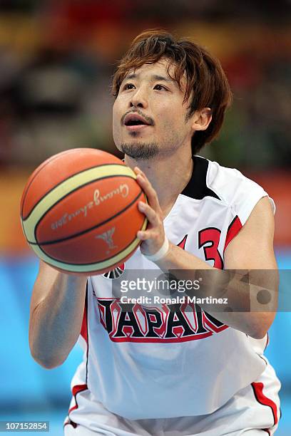 Yuta Tabuse of Japan at the free throw line in the second half against Iran during the men's bronze medal basketball game at the Guangzhou...