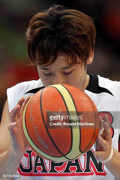 Yuta Tabuse of Japan at the free throw line in the second half against Iran during the men's bronze medal basketball game at the Guangzhou...