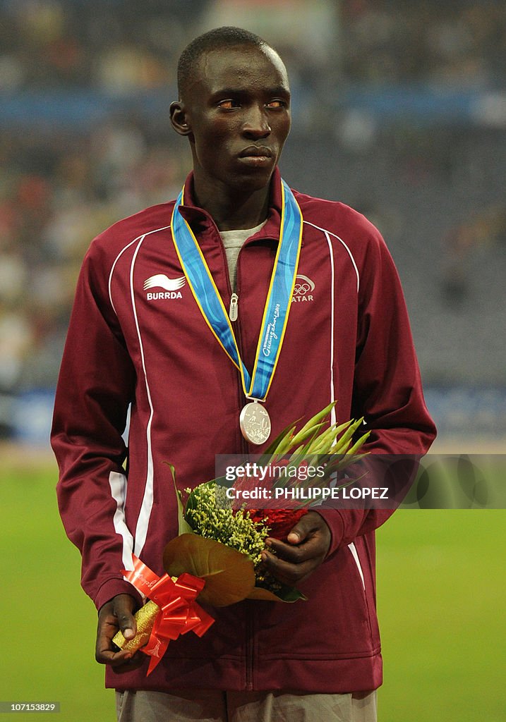 Ismail Rasheeda Essa Ismail Rashed of Qatar stands on the podium during the award ...