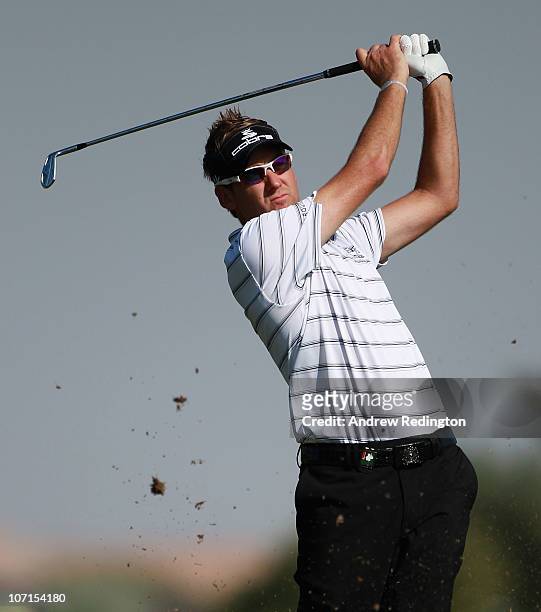 Ian Poulter of England hits his second shot on the tenth hole during the second round of the Dubai World Championship on the Earth Course, Jumeirah...