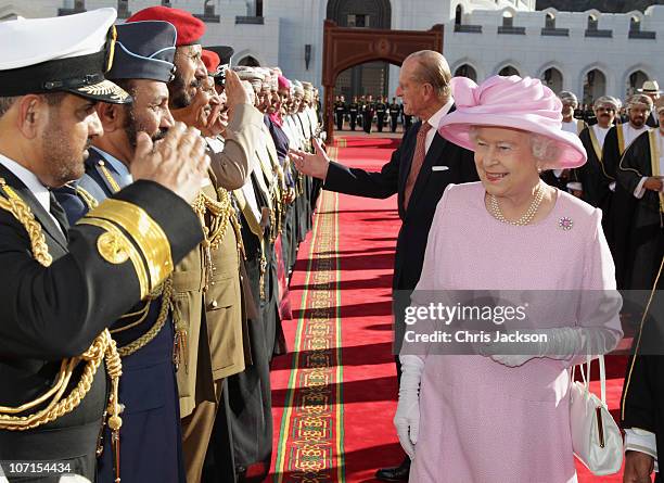 Queen Elizabeth II and Prince Philip, Duke of Edinburgh meet dignitaries as they visit Al-Alam Palace on November 26, 2010 in Muscat, Oman. Queen...