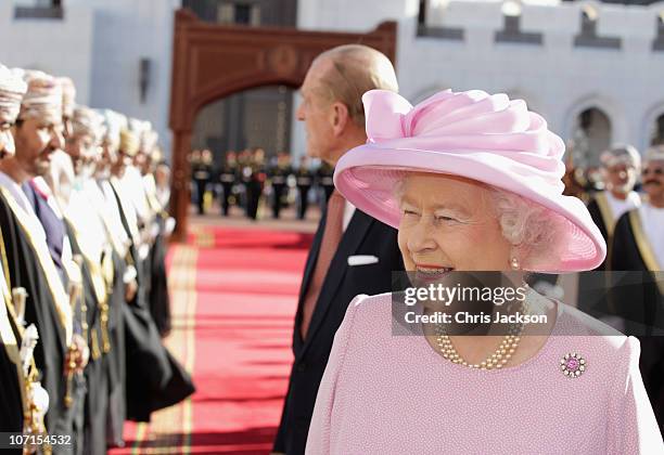 Queen Elizabeth II and Prince Philip, Duke of Edinburgh meet dignitaries as they visit Al-Alam Palace on November 26, 2010 in Muscat, Oman. Queen...