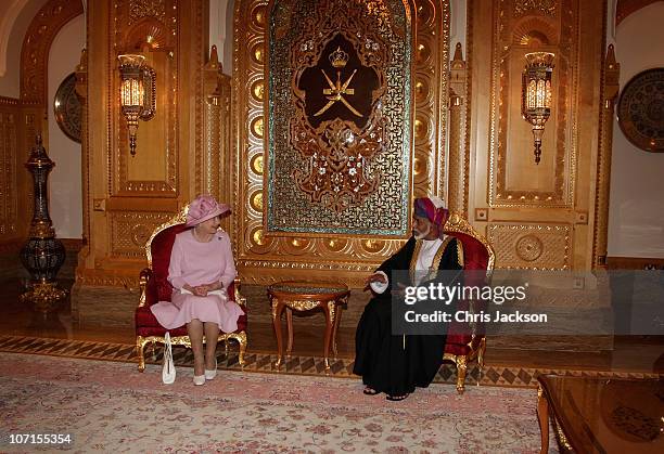 Queen Elizabeth II poses for a photograph with Sultan Qaboos bin Said as she visits Al-Alam Palace on November 26, 2010 in Muscat, Oman. Queen...