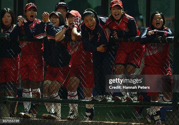 Japan celebrate a home run during the final match between China and Japan at Tianhe Softball Field during day fourteen of the 16th Asian Games...