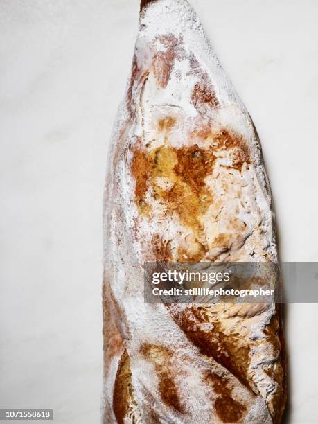 spoiled/ frozen baguette on white marble background - food contamination stock pictures, royalty-free photos & images