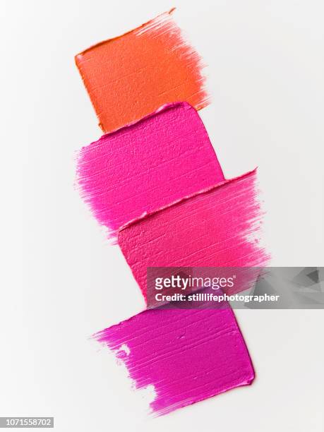 creative cosmetic smears on white background - rossetto foto e immagini stock