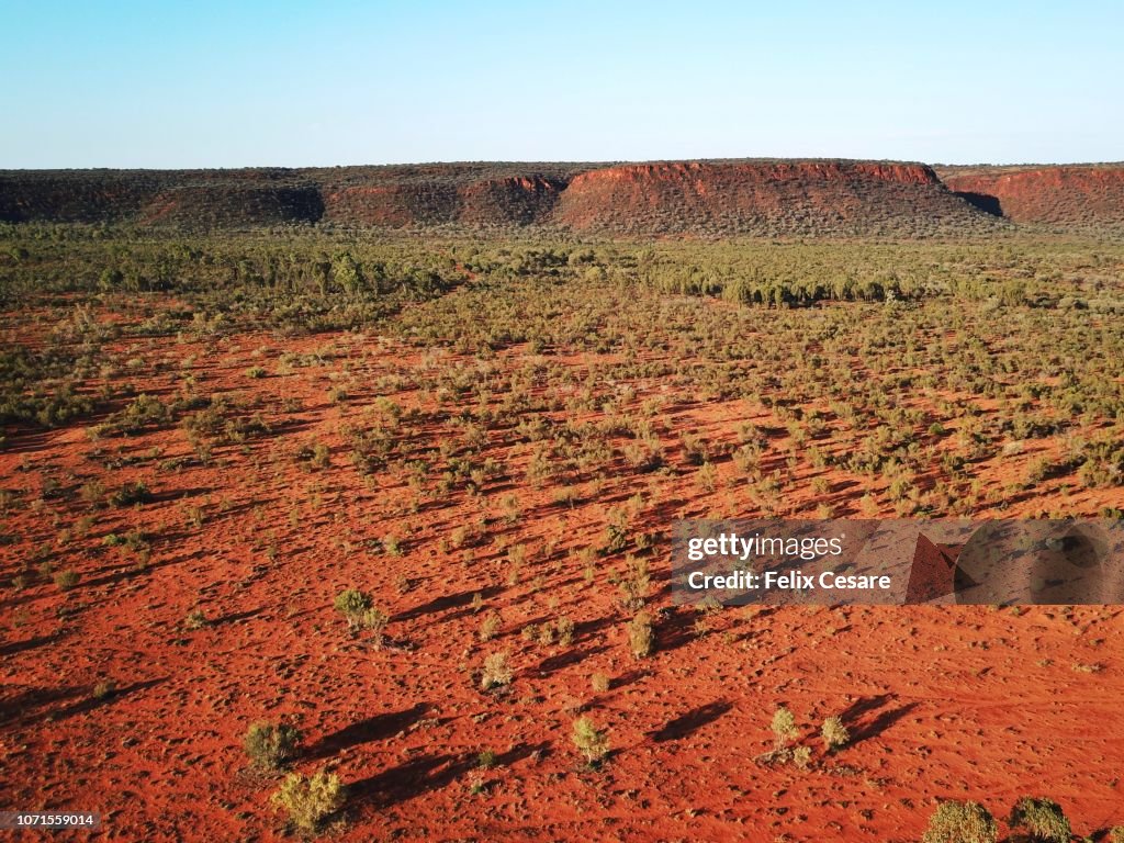 An Aerial shot of the red centre roads in the Australian Outback