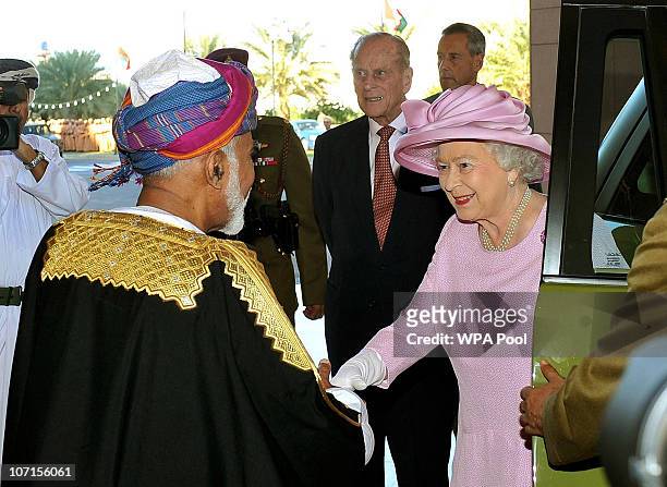 Queen Elizabeth II is greeted by the Sultan Qaboos bin Said as she and Prince Philip, Duke of Edinburgh arrive for their official welcome at the...