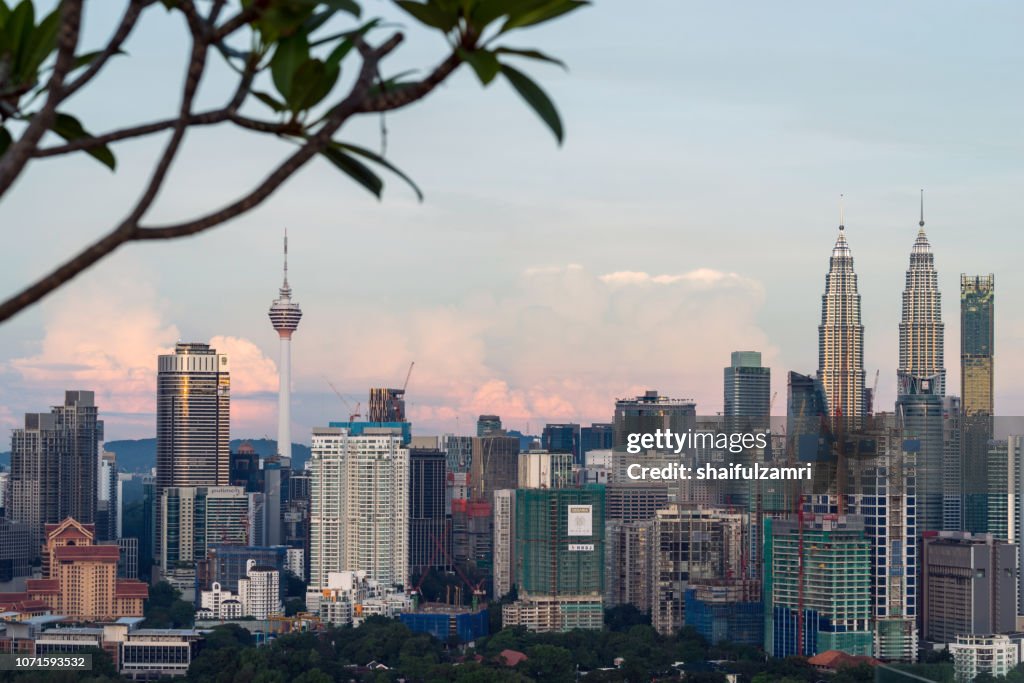 First light over Petronas Twin Towers,  a pair of glass and steel clad skyscrapers (451m).