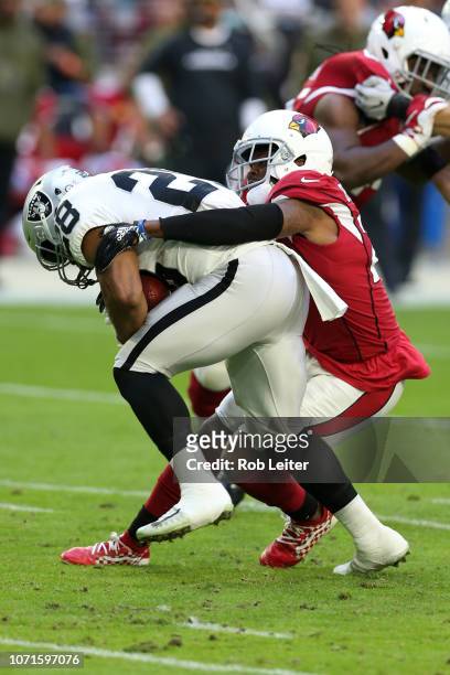 Bené Benwikere of the Arizona Cardinals makes a tackle during the game against the Oakland Raiders at State Farm Stadium on November 18, 2018 in...