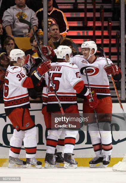 Jussi Jokinen, Tuomo Ruutu and Joni Pitkanen of the Carolina Hurricanes celebrate a goal in the first period against the Boston Bruins on November...