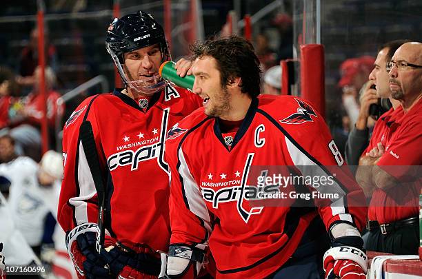 Mike Knuble and Alex Ovechkin of the Washington Capitals warm up before the game against the Tampa Bay Lightning at the Verizon Center on November...