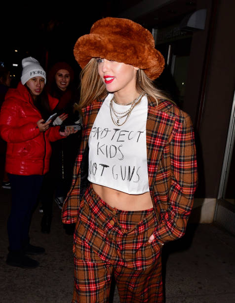 Miley Cyrus leaves Electric Lady Studios wearing a t-shirt saying "Protect kids not guns" on December 10, 2018 in New York City.