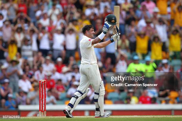 Michael Hussey of Australia celebrates scoring a century during day three of the First Ashes Test match between Australia and England at The Gabba on...