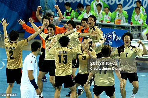 South Korea team celebrates winning the gold medal afterMen's Gold Medal Match at Huashi Gymnasium during day fourteen of the 16th Asian Games...