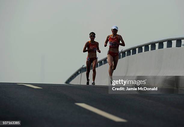 Chunxiu Zhou of China picks up the pace during the Wonen's Marathon at Triathlon Venue during day fifteen of the 16th Asian Games Guangzhou 2010 on...