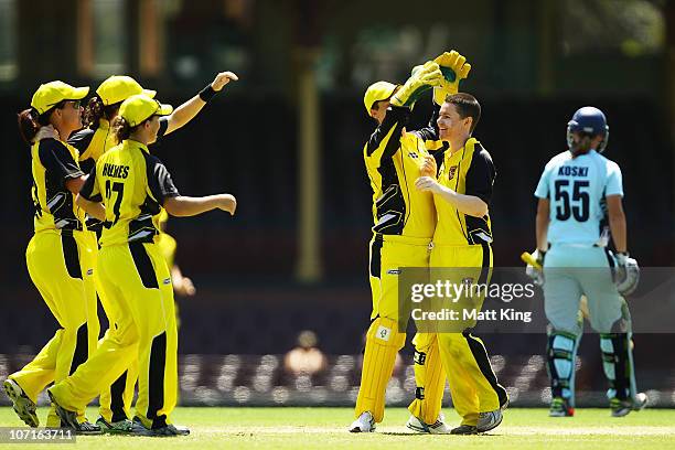 Renee Chappell of the Fury celebrates with wicket keeper Jenny Wallace after taking the wicket of Claire Koski of the Breakers during the WNCL match...