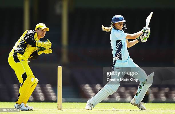 Ellyse Perry of the Breakers plays a cut shot as Jenny Wallace of the Fury keeps during the WNCL match between the New South Wales Breakers and the...