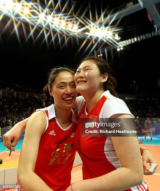 Yimei Wang and Yunwen Ma of China celebrate after winning the gold medail in the Women's Gold Medal Match between South Korea and China at Guangzhou...