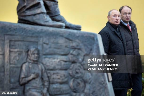 Russian President Vladimir Putin attends the unveiling ceremony of a statue of Russian writer and dissident Alexander Solzhenitsyn in Moscow on...